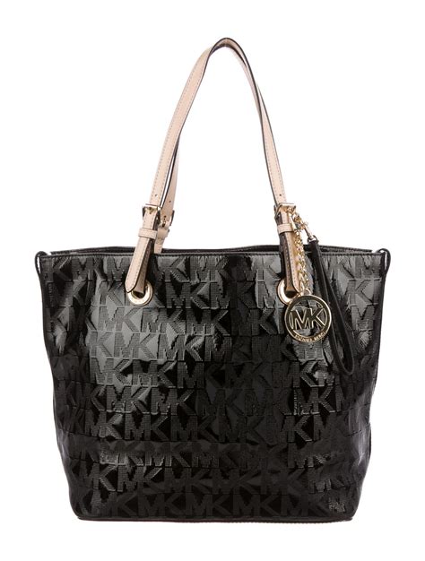 michael kors black leather handbag gold|Michael Kors black tote bag.